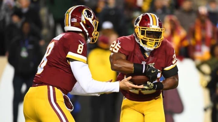 Nov 20, 2016; Landover, MD, USA; Washington Redskins running back Chris Thompson (25) receives the ball from quarterback Kirk Cousins (8) against the Green Bay Packers during the first half at FedEx Field. Mandatory Credit: Brad Mills-USA TODAY Sports