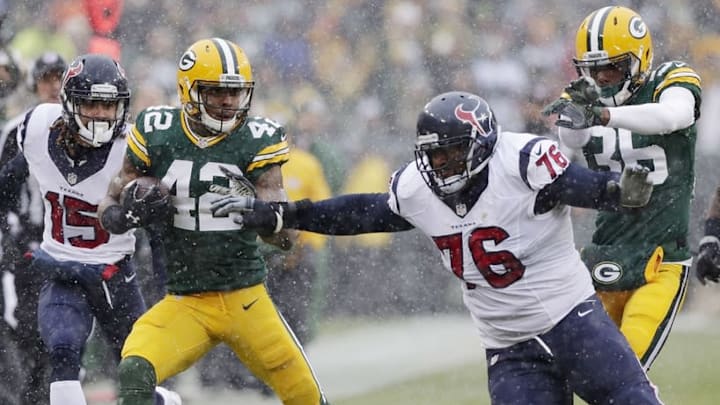 Dec 4, 2016; Green Bay, WI, USA; Green Bay Packers strong safety Morgan Burnett (42) is pushed out of bounds by Houston Texans tackle Duane Brown (76) after Burnett recovered a Houston fumble in the first quarter at Lambeau Field. Mandatory Credit: Adam Wesley/Green Bay Press Gazette via USA TODAY Sports