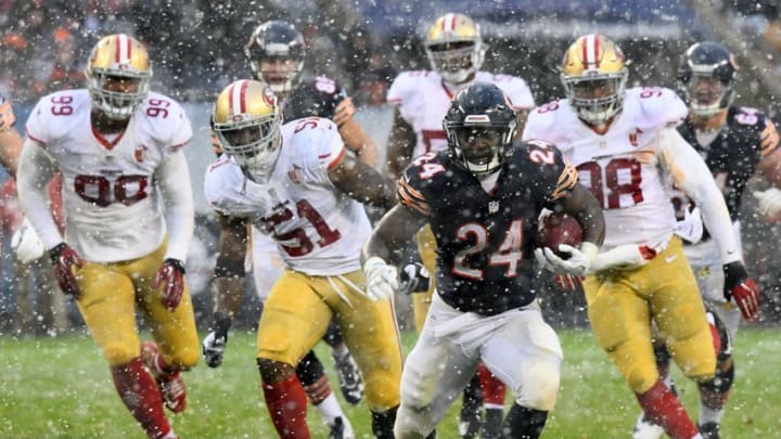 Dec 4, 2016; Chicago, IL, USA; Chicago Bears running back Jordan Howard (24) rushes the ball past San Francisco 49ers inside linebacker Gerald Hodges (51) and defensive end Ronald Blair (98) during the second half at Soldier Field. Mandatory Credit: Mike DiNovo-USA TODAY Sports