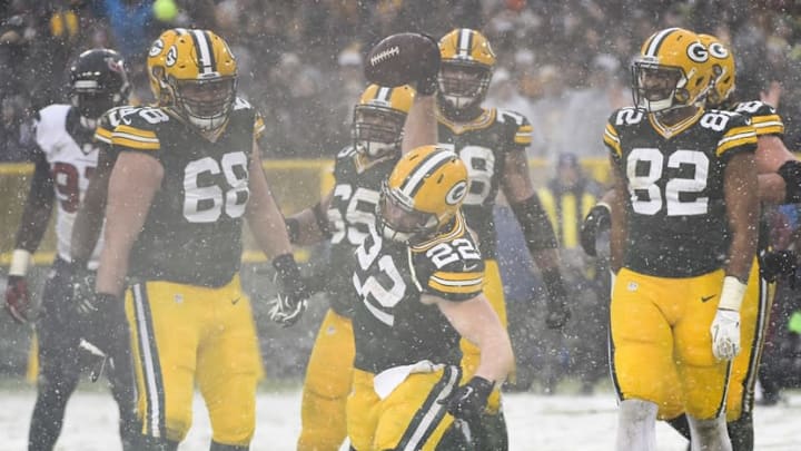 Dec 4, 2016; Green Bay, WI, USA; Green Bay Packers fullback Aaron Ripkowski (22) spikes the ball after scoring a touchdown in the fourth quarter against the Houston Texans at Lambeau Field. Mandatory Credit: Benny Sieu-USA TODAY Sports