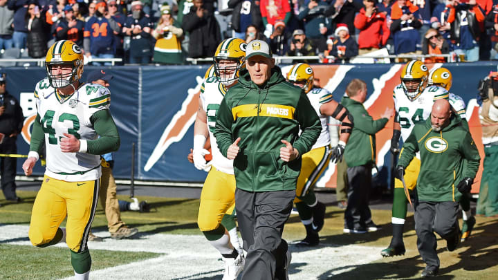 CHICAGO, IL – DECEMBER 16: Head coach Joe Philbin of the Green Bay Packers runs onto the field at the start of the game against the Chicago Bears at Soldier Field on December 16, 2018 in Chicago, Illinois. (Photo by Stacy Revere/Getty Images)