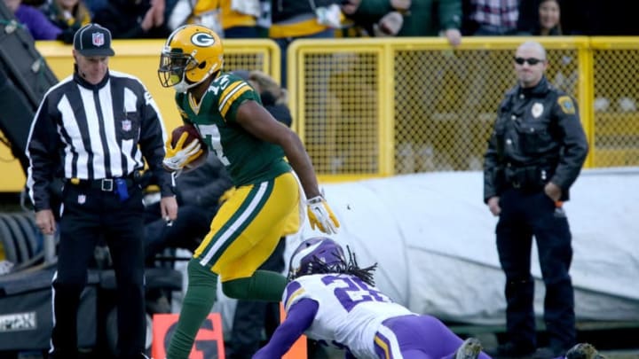 GREEN BAY, WI - DECEMBER 24: Davante Adams #17 of the Green Bay Packers scores a touchdown past Trae Waynes #26 of the Minnesota Vikings in the first quarter at Lambeau Field on December 24, 2016 in Green Bay, Wisconsin. (Photo by Dylan Buell/Getty Images)