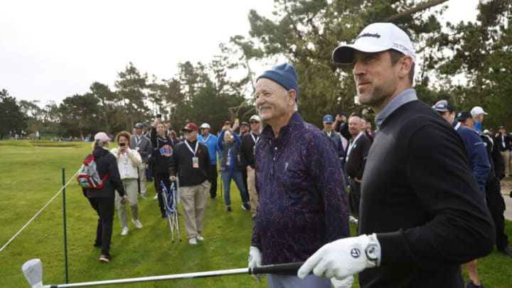 PEBBLE BEACH, CALIFORNIA - FEBRUARY 02: Bill Murray and Aaron Rodgers greet each other on the sixth hole during the first round of the AT&T Pebble Beach Pro-Am at Spyglass Hill Golf Course on February 02, 2023 in Pebble Beach, California. (Photo by Jed Jacobsohn/Getty Images)