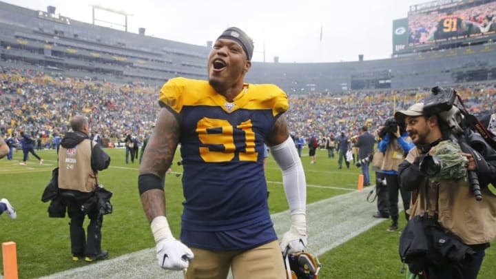 GREEN BAY, WISCONSIN - SEPTEMBER 22: Preston Smith #91 of the Green Bay Packers celebrates at the end of his team's win over the Denver Broncos at Lambeau Field on September 22, 2019 in Green Bay, Wisconsin. (Photo by Nuccio DiNuzzo/Getty Images)