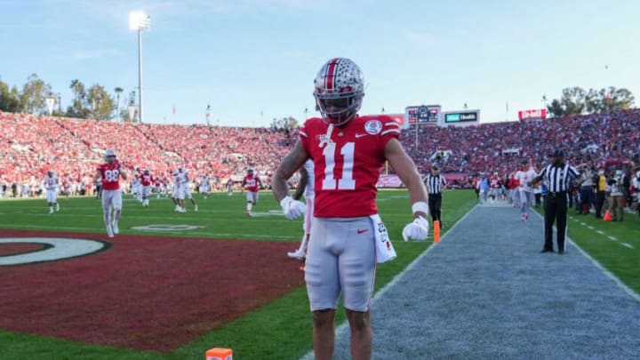 Sat., Jan. 1, 2022; Pasadena, California, USA; Ohio State Buckeyes wide receiver Jaxon Smith-Njigba (11) flexes after scoring a touchdown during the second quarter of the 108th Rose Bowl Game between the Ohio State Buckeyes and the Utah Utes at the Rose Bowl.Rose Bowl Game Ohio State Buckeyes Against Utah Utes