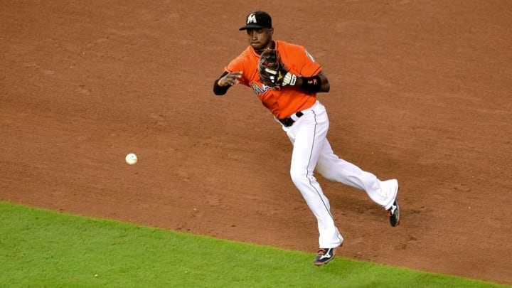 Aug 14, 2016; Miami, FL, USA; Miami Marlins shortstop Adeiny Hechavarria (3) throws over to first base during the fifth inning against the Chicago White Sox at Marlins Park. Mandatory Credit: Steve Mitchell-USA TODAY Sports