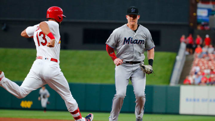 ST LOUIS, MO - JUNE 18: Garrett Cooper #26 of the Miami Marlins beats Matt Carpenter #13 of the St. Louis Cardinals to first base for an out in the third inning at Busch Stadium on June 18, 2019 in St Louis, Missouri. (Photo by Dilip Vishwanat/Getty Images)