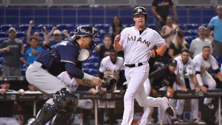 MIAMI, FL - JULY 11: Garrett Cooper #30 of the Miami Marlins scores the game winning run in the twelfth inning against the Milwaukee Brewers at Marlins Park on July 11, 2018 in Miami, Florida. (Photo by Eric Espada/Getty Images) MIAMI, FL - JULY 11: Garrett Cooper #30 of the Miami Marlins scores the game winning run in the twelfth inning against the Milwaukee Brewers at Marlins Park on July 11, 2018 in Miami, Florida. (Photo by Eric Espada/Getty Images)