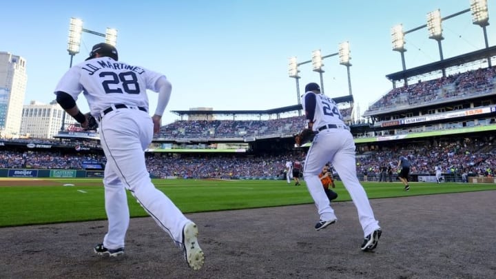 Aug 6, 2016; Detroit, MI, USA; Detroit Tigers right fielder J.D. Martinez (28) and first baseman Miguel Cabrera (24) take the field in the first inning against the New York Mets at Comerica Park. Mandatory Credit: Rick Osentoski-USA TODAY Sports