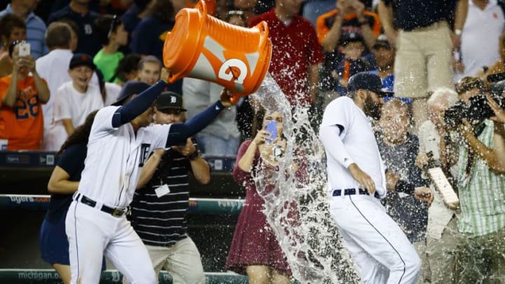 Aug 3, 2016; Detroit, MI, USA; Detroit Tigers shortstop Jose Iglesias (1) dumps water on J.D. Martinez (28) after the game against the Chicago White Sox at Comerica Park. Detroit won 2-1. Mandatory Credit: Rick Osentoski-USA TODAY Sports