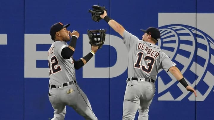 ANAHEIM, CA - AUGUST 06: Victor Reyes #22 and Mike Gerber #13 of the Detroit Tigers collide when Gerber caught a ball off the bat of Kole Calhoun of the Los Angeles Angels of Anaheim at Angel Stadium on August 6, 2018 in Anaheim, California. (Photo by John McCoy/Getty Images)