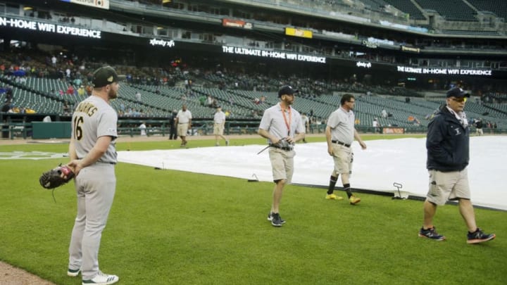 DETROIT, MI - MAY 19: Liam Hendriks #16 of the Oakland Athletics watches the grounds crew walk away after coving the field at Comerica Park during the seventh inning of a game against the Detroit Tigers on May 19, 2019 in Detroit, Michigan. (Photo by Duane Burleson/Getty Images)