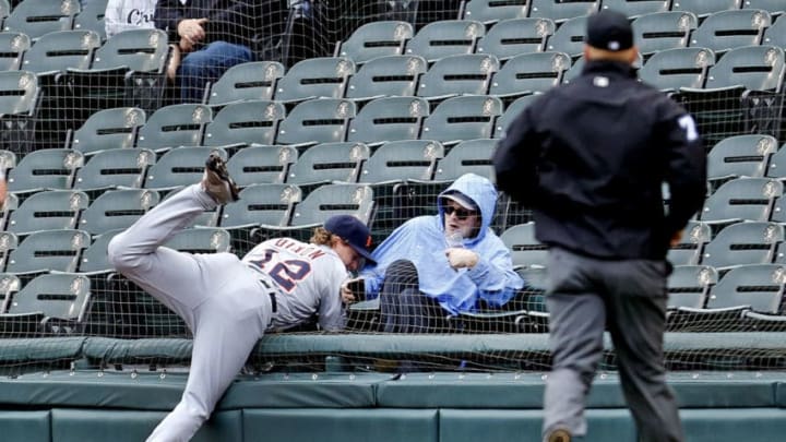 CHICAGO, ILLINOIS - SEPTEMBER 28: Brandon Dixon #12 of the Detroit Tigers ends up in the stands chasing a foul ball off the bat of Yoan Moncada of the Chicago White Sox in the second inning of a game at Guaranteed Rate Field on September 28, 2019 in Chicago, Illinois. (Photo by Nuccio DiNuzzo/Getty Images)