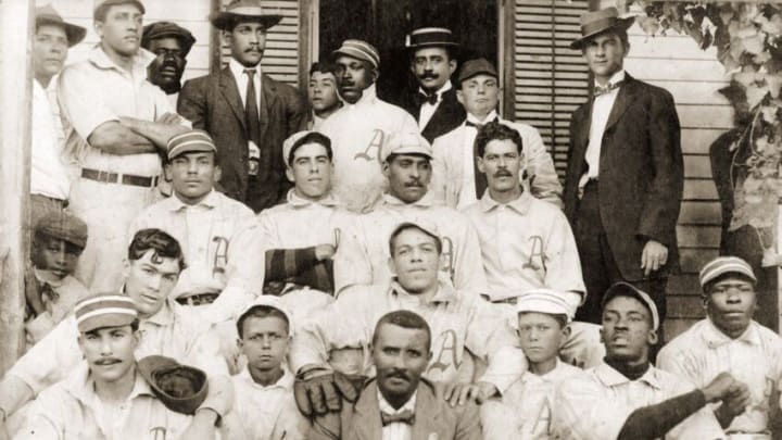 HAVANA, CUBA - CIRCA 1908: Jose Mendez, Carlos Royer, Gervasio Gonzalez, Regino Garcia, Rafael Almeda, and Armando Marsans and the Almendares Team of the Cuban winter league pose with their officers, directors, assistants and fans for the team portrait in Havana, Cuba in 1908. (Photo Reproduction by Transcendental Graphics/Getty Images)