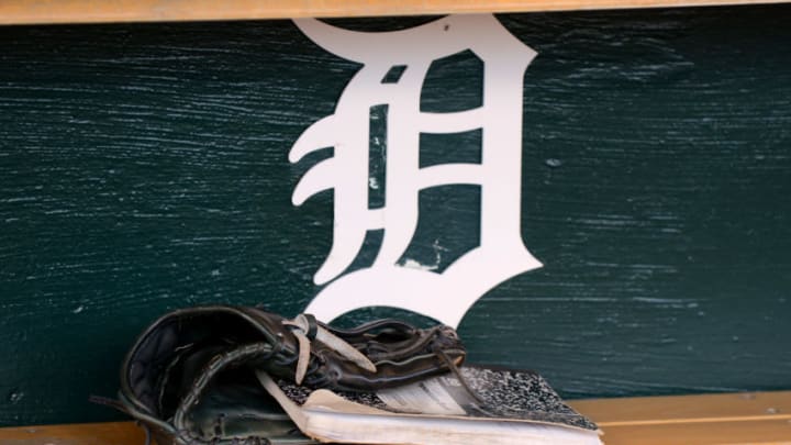 DETROIT, MI - SEPTEMBER 23: A detailed view of the baseball glove and notebook of J.D. Martinez #28 of the Detroit Tigers sitting in the dugout prior to the game against the Chicago White Sox at Comerica Park on September 23, 2014 in Detroit, Michigan. The Tigers defeated the White Sox 4-3. (Photo by Mark Cunningham/MLB Photos via Getty Images)