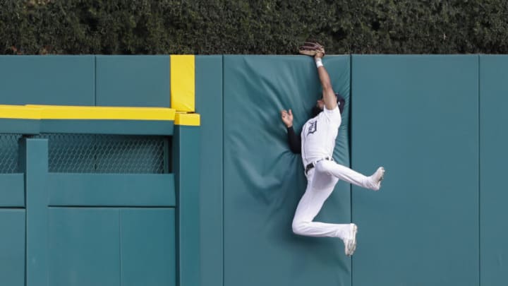 Tigers center fielder Derek Hill makes a leaping catch at the wall. Raj Mehta-USA TODAY Sports