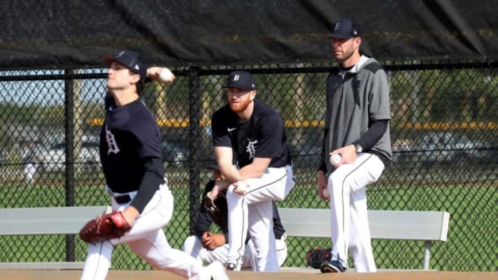 Tigers pitcher Spencer Turnbull, center, and pitching coach Chris Fetter watch as pitcher Casey Mize throws in the bullpen during Detroit Tigers spring training on Wednesday, March 16, 2022, at TigerTown in Lakeland, Florida.Tigers3