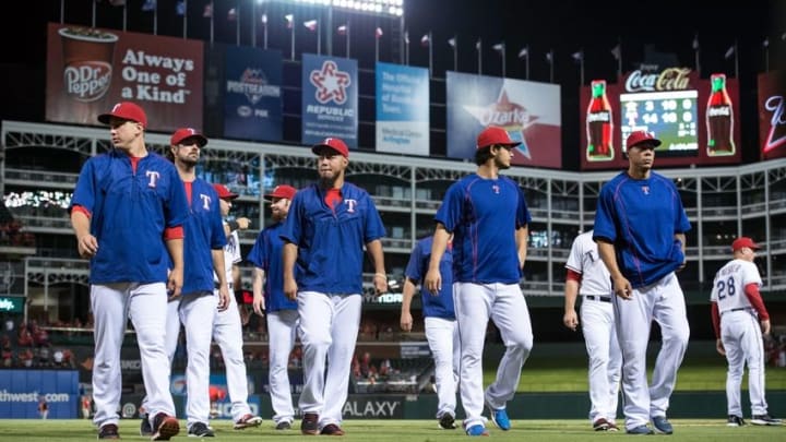 Sep 16, 2015; Arlington, TX, USA; Texas Rangers starting pitcher Derek Holland (45) and starting pitcher Cole Hamels (35) and starting pitcher Yovani Gallardo (49) and starting pitcher Yu Darvish (11) and first baseman Kyle Blanks (88) walk off the field after the game against the Houston Astros at Globe Life Park in Arlington. The Rangers defeat the Astros 14-3. Mandatory Credit: Jerome Miron-USA TODAY Sports