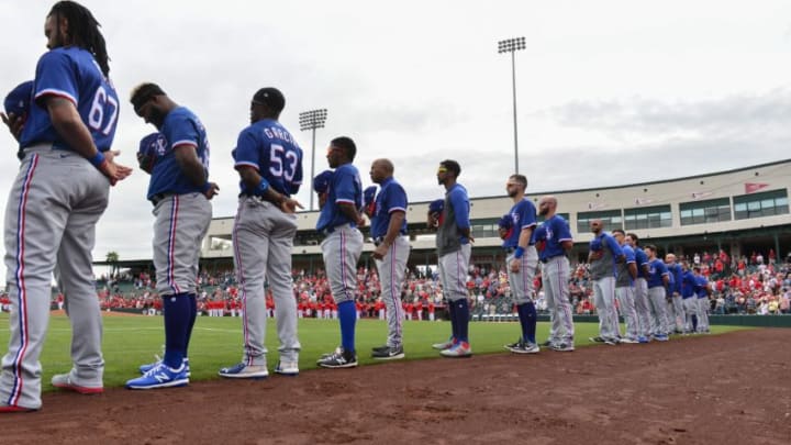 Feb 28, 2020; Tempe, Arizona, USA; The Texas Rangers look on during the national anthem prior to the game against the Los Angeles Angels at Tempe Diablo Stadium. Mandatory Credit: Matt Kartozian-USA TODAY Sports