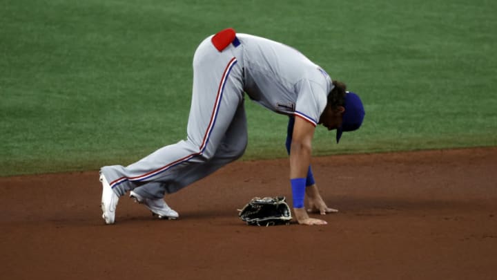 Apr 12, 2021; St. Petersburg, Florida, USA; Texas Rangers left fielder Ronald Guzman (11) reacts after suffering an apparent injury during the first inning against the Tampa Bay Rays at Tropicana Field. Guzman left the game after the play. Mandatory Credit: Kim Klement-USA TODAY Sports
