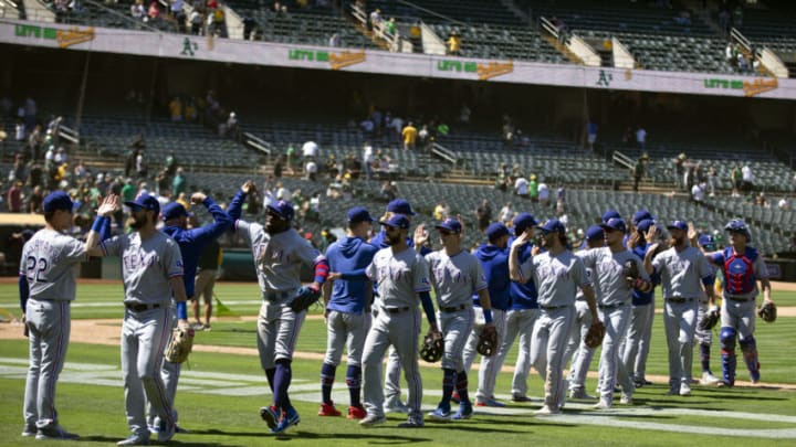 Jul 1, 2021; Oakland, California, USA; Texas Rangers players celebrate their 8-3- victory over the Texas Rangers at RingCentral Coliseum. Mandatory Credit: D. Ross Cameron-USA TODAY Sports