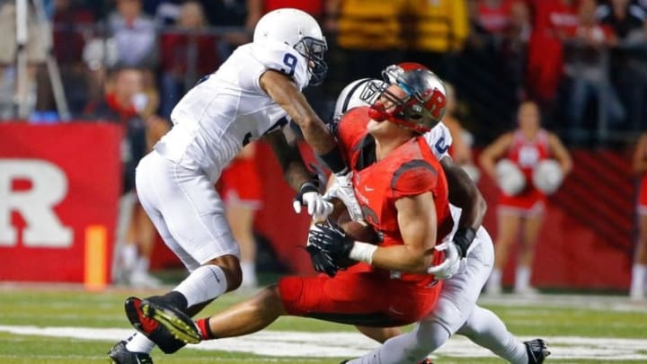 Sep 13, 2014; Piscataway, NJ, USA; Rutgers Scarlet Knights tight end Tyler Kroft (86) is tackled by Penn State Nittany Lions cornerback Jordan Lucas (9) and linebacker Nyeem Wartman (5) during the first half at High Points Solutions Stadium. Mandatory Credit: Jim O