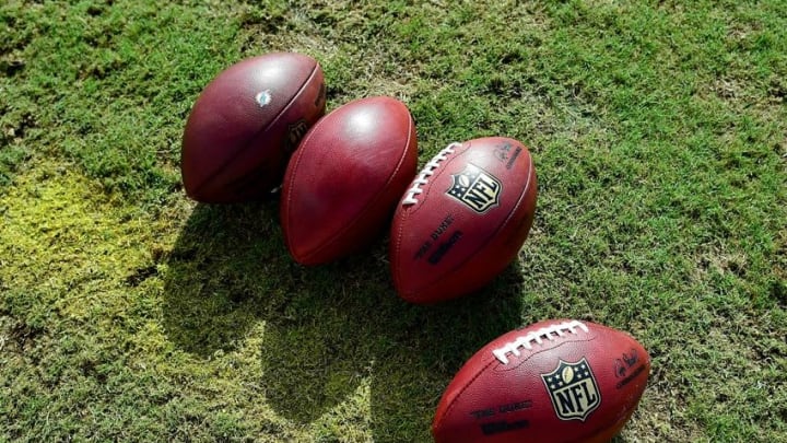 Aug 4, 2016; Miami Gardens, FL, USA; NFL football are seen at the practice field during practice drills at Baptist Health Training Facility. Mandatory Credit: Steve Mitchell-USA TODAY Sports