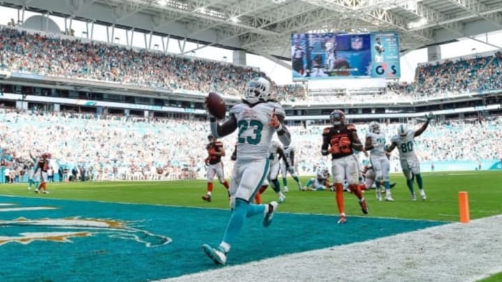 Sep 25, 2016; Miami Gardens, FL, USA; Miami Dolphins running back Jay Ajayi (23) celebrates his game winning touchdown in overtime against the Cleveland Browns at Hard Rock Stadium. Mandatory Credit: Steve Mitchell-USA TODAY Sports