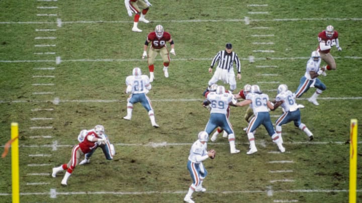 SAN FRANCISCO - DECEMBER 6: Dan Marino #13 of the Miami Dolphins drops back to pass during a National Football League game against the San Francisco 49ers played at Candlestick Park on December 6, 1992 in San Francisco, California. Other visible players include Mark Higgs #21, Keith Sims #69, Jeff Uhlenhake #63, Harry Galbreath #62 of the Dolphins; Bill Romanowski #53, Keith DeLong #59, Mike Walter #99 of the 49er's. (Photo by David Madison/Getty Images)
