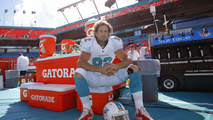MIAMI GARDENS, FL - DECEMBER 28: Long snapper John Denney #92 of the Miami Dolphins sits on a cooler during pregame workouts before the Dolphins met the New York Jets in a game at Sun Life Stadium on December 28, 2014 in Miami Gardens, Florida. (Photo by Chris Trotman/Getty Images)