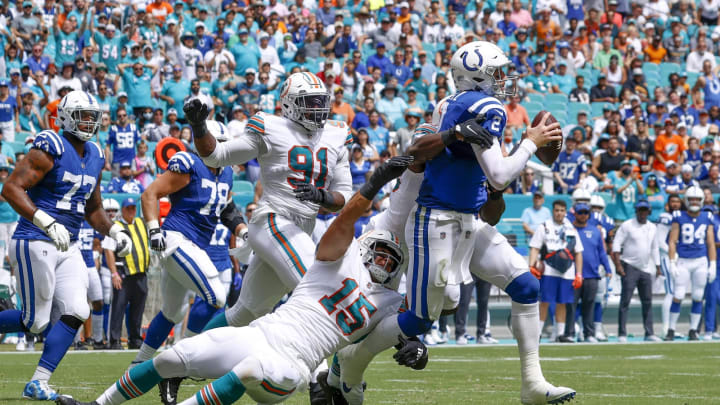 MIAMI GARDENS, FL – OCTOBER 3: Jaelan Phillips #15 of the Miami Dolphins sacks Carson Wentz #2 of the Indianapolis Colts as he releases the ball during an NFL game on October 3, 2021 at Hard Rock Stadium in Miami Gardens, Florida. (Photo by Joel Auerbach/Getty Images)