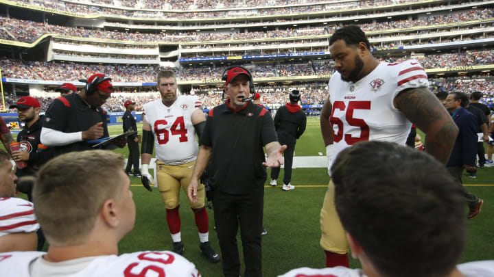 INGLEWOOD, CA – JANUARY 9: Offensive Line Coach Chris Foerster of the San Francisco 49ers talks wit the offensive line on the sidelines during the game against the Los Angeles Rams at SoFi Stadium on January 9, 2022 in Inglewood, California. The 49ers defeated the Rams 27-24. (Photo by Michael Zagaris/San Francisco 49ers/Getty Images)