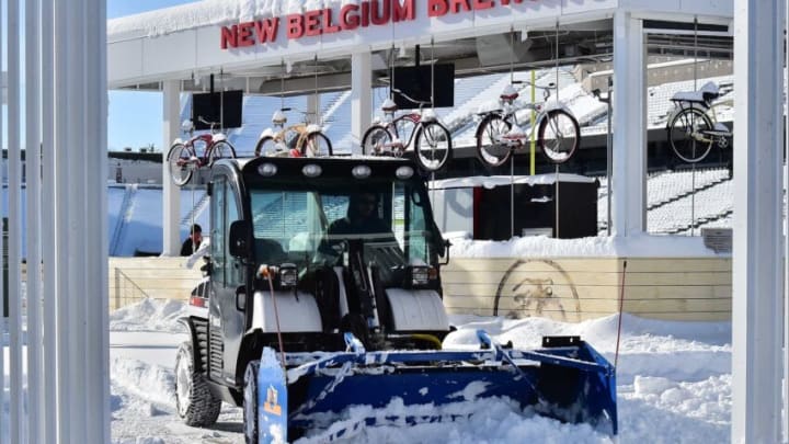 A plow clears snow from the New Belgium Porch at Colorado State's Canvas Stadium on Wednesday, Nov. 27, 2019, in preparation for a Nov. 29 game against Boise State.Plow On Porch