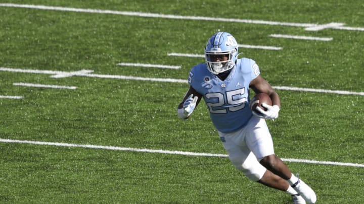 Dec 5, 2020; Chapel Hill, North Carolina, USA; North Carolina Tar Heels running back Javonte Williams (25) with the ball in the second quarter at Kenan Memorial Stadium. Mandatory Credit: Bob Donnan-USA TODAY Sports