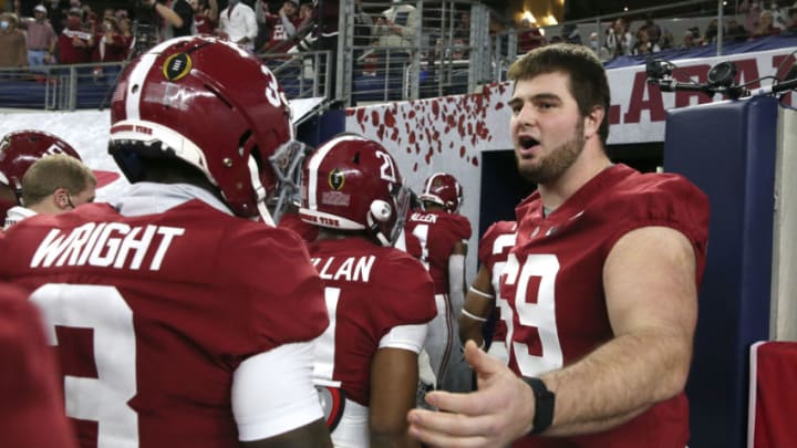Jan 1, 2021; Arlington, TX, USA; Alabama Crimson Tide offensive lineman Landon Dickerson (69) greets teammates as they enter the locker room after warmups Friday, Jan. 1, 2021 in the College Football Playoff Semifinal hosted by the Rose Bowl in AT&T Stadium. Mandatory Credit: Gary Cosby-USA TODAY Sports