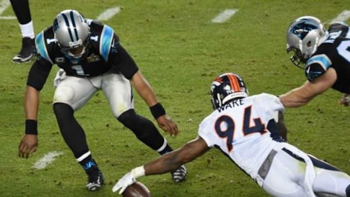 Feb 7, 2016; Santa Clara, CA, USA; Denver Broncos outside linebacker DeMarcus Ware (94) grabs a loose ball ahead of Carolina Panthers quarterback Cam Newton (1) during the fourth quarter in Super Bowl 50 at Levi Feb 7, 2016; Santa Clara, CA, USA; Denver Broncos outside linebacker DeMarcus Ware (94) grabs a loose ball ahead of Carolina Panthers quarterback Cam Newton (1) during the fourth quarter in Super Bowl 50 at Levi