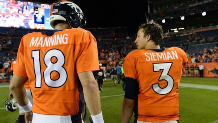 Sep 3, 2015; Denver, CO, USA; Denver Broncos quarterback Peyton Manning (18) and quarterback Trevor Siemian (3) following a preseason game against the Arizona Cardinals at Sports Authority Field at Mile High. The Cardinals defeated the Broncos 22-20. Mandatory Credit: Ron Chenoy-USA TODAY Sports