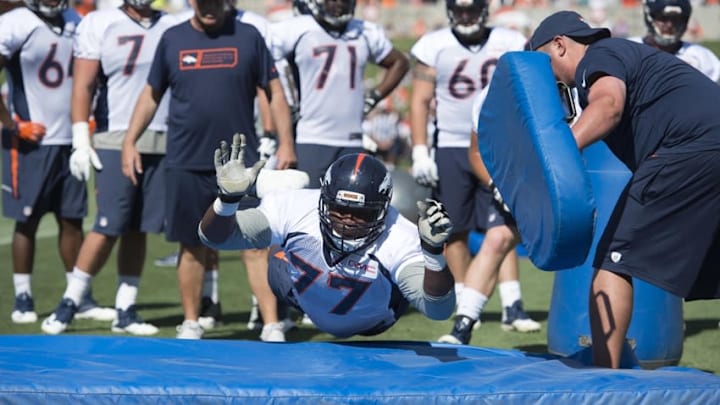 Jul 28, 2016; Englewood, CO, USA; Denver Broncos offensive tackle Darrion Weems (77) during training camp drills held at the UCHealth Training Center. Mandatory Credit: Ron Chenoy-USA TODAY Sports