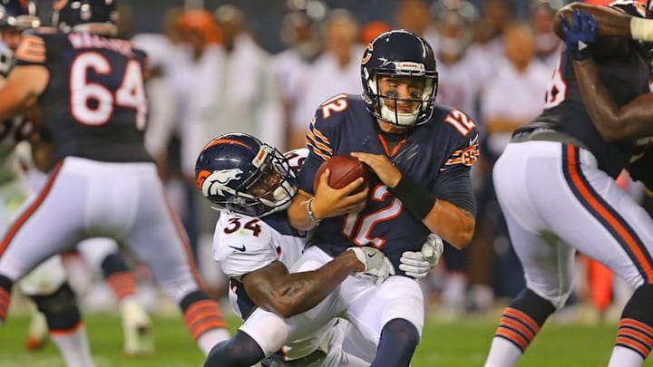 Aug 11, 2016; Chicago, IL, USA; Chicago Bears quarterback David Fales (12) is sacked by Denver Broncos defensive back Will Parks (34) during the second half at Soldier Field. Denver won 22-0. Mandatory Credit: Dennis Wierzbicki-USA TODAY Sports