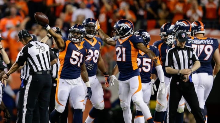 Oct 24, 2016; Denver, CO, USA; Denver Broncos inside linebacker Todd Davis (51) celebrates with cornerback Aqib Talib (21) after recovering a fumble in the third quarter against the Houston Texans at Sports Authority Field at Mile High. Mandatory Credit: Isaiah J. Downing-USA TODAY Sports