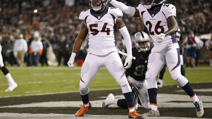 Nov 6, 2016; Oakland, CA, USA; Denver Broncos inside linebacker Brandon Marshall (54) reacts next to safety Darian Stewart (26) after making a defensive stop against the Oakland Raiders in the first quarter at Oakland Coliseum. Mandatory Credit: Cary Edmondson-USA TODAY Sports