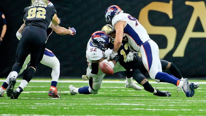 Nov 13, 2016; New Orleans, LA, USA; Denver Broncos inside linebacker Corey Nelson (52) and defensive end Jared Crick (93) force a fumble by New Orleans Saints wide receiver Michael Thomas (13) during the fourth quarter of a game at the Mercedes-Benz Superdome. The Broncos defeated the Saints 25-23. Mandatory Credit: Derick E. Hingle-USA TODAY Sports