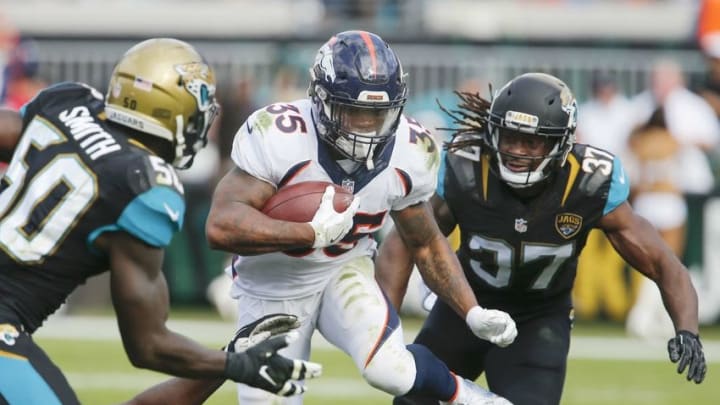 Dec 4, 2016; Jacksonville, FL, USA; Jacksonville Jaguars outside linebacker Telvin Smith (50) and strong safety Johnathan Cyprien (37) chase Denver Broncos running back Kapri Bibbs (35) during the second quarter of an NFL football game at EverBank Field. Mandatory Credit: Reinhold Matay-USA TODAY Sports