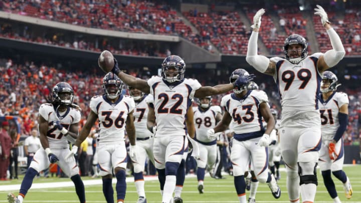 HOUSTON, TX - DECEMBER 08: Kareem Jackson #22 of the Denver Broncos celebrates with temmates after an interception in the fourth quarter against the Houston Texans at NRG Stadium on December 8, 2019 in Houston, Texas. (Photo by Tim Warner/Getty Images)