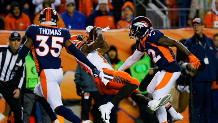 DENVER, CO - DECEMBER 15: Wide receiver Breshad Perriman #19 of the Cleveland Browns falls into the end zone with a first quarter touchdown catch under coverage by defensive back Tramaine Brock #22 and defensive back Dymonte Thomas #35 of the Denver Broncos during a game at Broncos Stadium at Mile High on December 15, 2018 in Denver, Colorado. (Photo by Justin Edmonds/Getty Images)