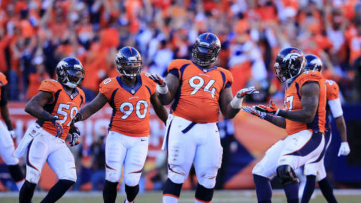 DENVER, CO – JANUARY 19: Terrance Knighton #94 of the Denver Broncos and teammates celebrate after he sacked Tom Brady #12 of the New England Patriots in the fourth quarter during the AFC Championship game at Sports Authority Field at Mile High on January 19, 2014 in Denver, Colorado. (Photo by Jamie Squire/Getty Images)