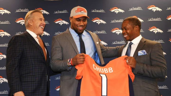 ENGLEWOOD, CO - APRIL 27: President of Football Operations/General Manager John Elway, left, and Denver Broncos head coach Vance Joseph, right, present their 1st round draft pick Bradley Chubb, center, with a Broncos jersey at Dove Valley April 27, 2018. (Photo by Andy Cross/The Denver Post via Getty Images)