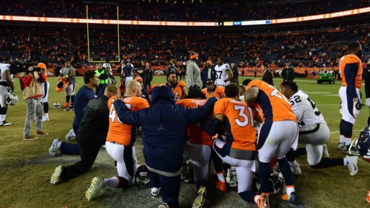 DENVER, CO - JANUARY 1: Denver Broncos players huddle together after defeating the Oakland Raiders 24-6 at Sports Authority Field at Mile High on January 1, 2017 in Denver, Colorado. (Photo by Dustin Bradford/Getty Images)