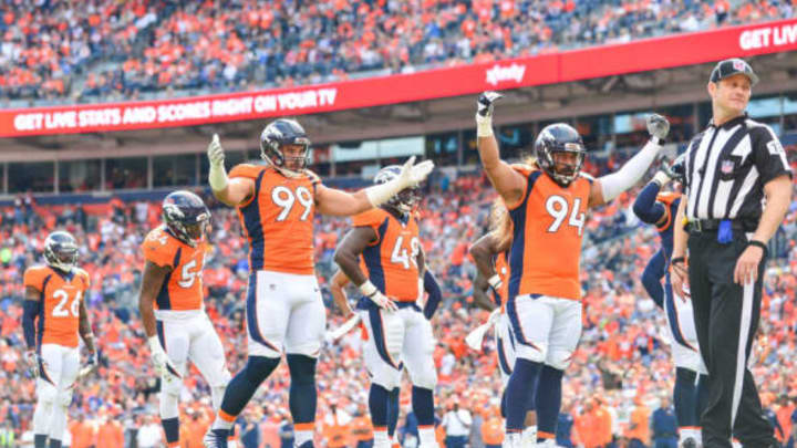 DENVER, CO – OCTOBER 1: Nose tackle Domata Peko #94 and defensive end Adam Gotsis #99 of the Denver Broncos try to get the crowd to get loud in the second quarter of a game against the Oakland Raiders at Sports Authority Field at Mile High on October 1, 2017 in Denver, Colorado. (Photo by Dustin Bradford/Getty Images)