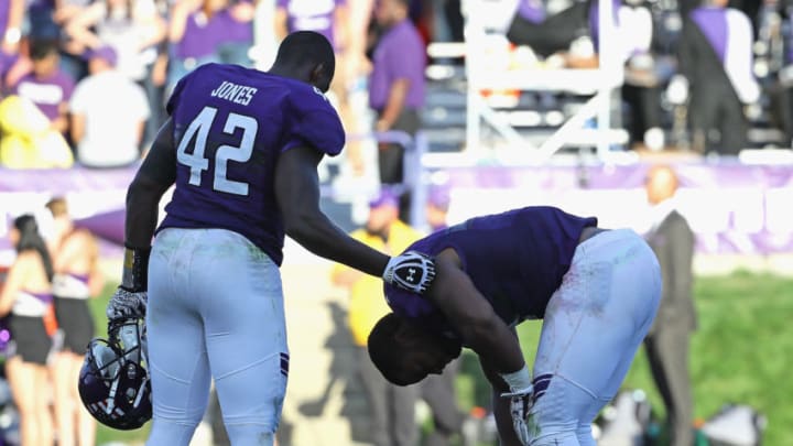 EVANSTON, IL - SEPTEMBER 10: Joseph Jones #42 and Anthony Walker Jr. #1 of the Northwestern Wildcats react after a loss to the Illinois State Redbirds at Ryan Field on September 10, 2016 in Evanston, Illinois. Illiinois State defeated Northwestern 9-7. (Photo by Jonathan Daniel/Getty Images)